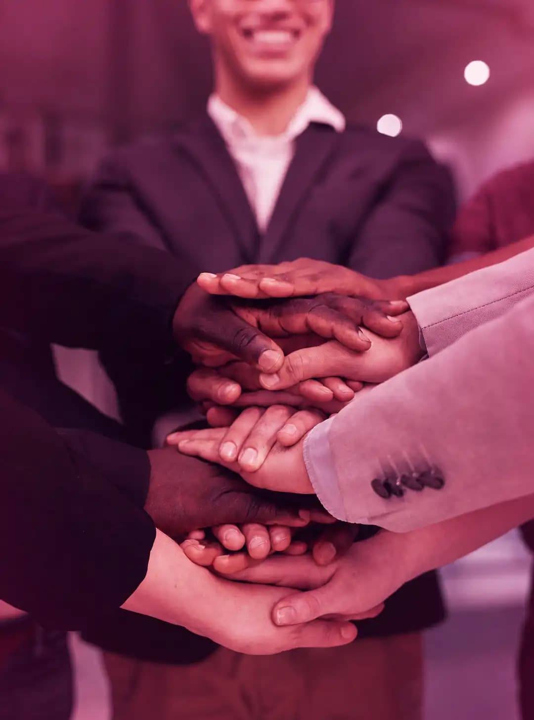 Hands stacked together representing unity